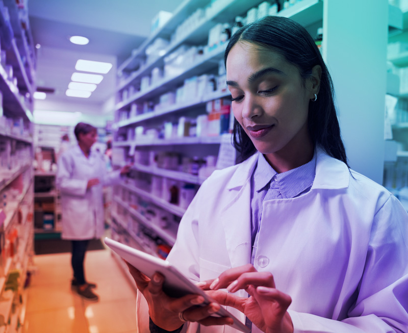 Pharmacist using a tablet